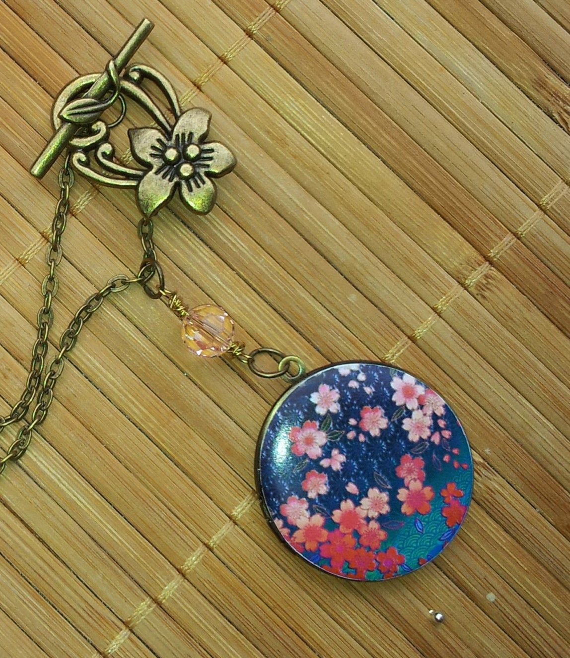 Cherry Blossom Sakura Round Bronze Art Locket Necklace – Plum Flowers  Toggle Clasp Blue Pink Mothers Day Christmas Grandmother Gift Floral Intended For 2019 Pink Cherry Blossom Flower Locket Element Necklaces (View 5 of 25)