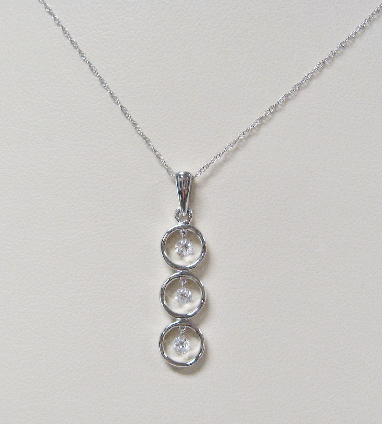 This 14k White Gold Three Circle Pendant Has 3 Shimmering Diamonds Within Latest Shimmering Knot Pendant Necklaces (View 21 of 25)