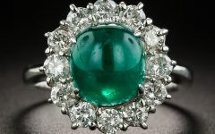 25 Collection of Emerald Cabochon Halo Rings